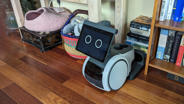 Astro sitting on his charging dock in a new location that doesn't have any overhead obstructions.